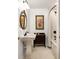 Cozy bathroom featuring a sink, vanity, tiled floors, mirror and tub with a shower at 164 Ridley Cir, Decatur, GA 30030