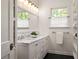 Bright bathroom with double vanity, marble countertop, and ample storage space, offering a luxurious experience at 164 Ridley Cir, Decatur, GA 30030