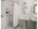 Bright bathroom with a walk-in shower, double sinks, white subway tile and neutral paint at 164 Ridley Cir, Decatur, GA 30030
