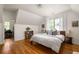 Bright bedroom with hardwood floors, large windows, and an en-suite office space is perfect for relaxing and working at 164 Ridley Cir, Decatur, GA 30030