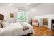 Cozy bedroom featuring hardwood floors, soft lighting, and a comfortable atmosphere, ideal for relaxation at 164 Ridley Cir, Decatur, GA 30030