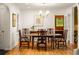 Formal dining room featuring hardwood floors, natural lighting, and classic wood furnishings at 164 Ridley Cir, Decatur, GA 30030