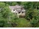 Exterior view of charming two-story home with lush landscaping at 164 Ridley Cir, Decatur, GA 30030
