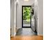 Elegant foyer with hardwood floors, arched doorways, and a view of the outdoors through the front door at 164 Ridley Cir, Decatur, GA 30030