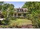 Lovely home with manicured lawn and mature trees providing shade and privacy at 164 Ridley Cir, Decatur, GA 30030