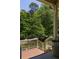 Inviting front porch with white railings and a view of the tree-lined street at 164 Ridley Cir, Decatur, GA 30030