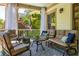 Cozy outdoor seating area on a covered porch with comfortable furniture and stylish decor at 164 Ridley Cir, Decatur, GA 30030