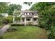 Charming two-story home with inviting front porch and lush landscaping at 164 Ridley Cir, Decatur, GA 30030