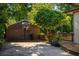 View of detached garage with basketball hoop and mature tree at 164 Ridley Cir, Decatur, GA 30030