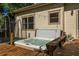 Backyard view showcases a relaxing hot tub with wooden deck, ideal for outdoor entertaining at 164 Ridley Cir, Decatur, GA 30030