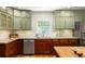 Well-lit kitchen with dual-tone cabinets, stainless steel appliances, and ample counter space at 164 Ridley Cir, Decatur, GA 30030