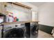 Well-organized laundry room with a modern washer and dryer and functional storage solutions at 164 Ridley Cir, Decatur, GA 30030