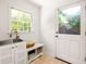 Mud room features a convenient sink, storage bench, and an exterior door with window at 164 Ridley Cir, Decatur, GA 30030
