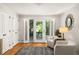 Sunroom featuring french doors, neutral paint, hardwood floors, and views of the back yard at 164 Ridley Cir, Decatur, GA 30030