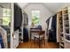 Well-organized walk-in closet with custom shelving and storage solutions, illuminated by natural light at 164 Ridley Cir, Decatur, GA 30030