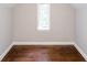 Bright attic space featuring hardwood floors and a window for natural light at 2607 Jefferson Ter, Atlanta, GA 30344