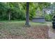 Spacious backyard features mature trees, a storage shed, and plenty of greenery at 2607 Jefferson Ter, Atlanta, GA 30344