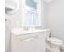 Well-lit bathroom offers a white vanity and modern fixtures throughout at 2607 Jefferson Ter, Atlanta, GA 30344