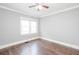 Cozy bedroom features neutral paint, ceiling fan, and new windows at 2607 Jefferson Ter, Atlanta, GA 30344