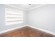 Light-filled bedroom features hardwood floors and a built-in bookshelf at 2607 Jefferson Ter, Atlanta, GA 30344