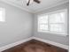 Bright bedroom with dark wood floors, large windows and ceiling fan at 2607 Jefferson Ter, Atlanta, GA 30344