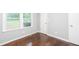 Bedroom featuring hardwood floors, neutral gray walls, and natural light at 2607 Jefferson Ter, Atlanta, GA 30344