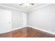Bedroom with ceiling fan, hardwood floors, and neutral paint at 2607 Jefferson Ter, Atlanta, GA 30344