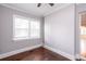 Bright bedroom with dark wood floors, large windows and ceiling fan at 2607 Jefferson Ter, Atlanta, GA 30344