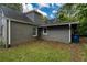 View of the backyard featuring the home's gray siding and a well-maintained yard at 2607 Jefferson Ter, Atlanta, GA 30344