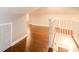 Hallway on second floor with wood floors and white bannister at 2607 Jefferson Ter, Atlanta, GA 30344