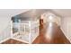 Second floor hallway with hardwood floors, white trim and stairway at 2607 Jefferson Ter, Atlanta, GA 30344