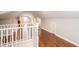 Second floor hallway with hardwood floors, white trim and stairway at 2607 Jefferson Ter, Atlanta, GA 30344