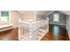 Second floor hallway with hardwood floors, white trim and stairway at 2607 Jefferson Ter, Atlanta, GA 30344