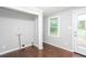 Laundry room with gray walls, hardwood floors, window and door to back yard at 2607 Jefferson Ter, Atlanta, GA 30344