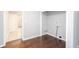 Laundry room with hardwood floors, gray walls, and washer/dryer hookups at 2607 Jefferson Ter, Atlanta, GA 30344
