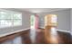 Bright living room with hardwood floors, large windows, and an arched doorway at 2607 Jefferson Ter, Atlanta, GA 30344