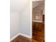 Open living room featuring built-in shelving and hardwood floors, enhancing the space at 2607 Jefferson Ter, Atlanta, GA 30344
