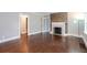 Living room featuring hardwood floors, a fireplace, and neutral walls at 2607 Jefferson Ter, Atlanta, GA 30344