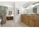 Bright bathroom features a granite countertop, double vanity, and walk-in shower at 2710 Hedgewood Nw Dr, Atlanta, GA 30311
