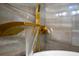 Close up of a modern golden faucet with running water filling up a white tub at 2710 Hedgewood Nw Dr, Atlanta, GA 30311