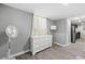 Charming bedroom featuring a white dresser and a window with curtains at 2710 Hedgewood Nw Dr, Atlanta, GA 30311