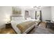Bedroom featuring two beds, soft lighting, and neutral decor for a relaxing retreat at 2710 Hedgewood Nw Dr, Atlanta, GA 30311