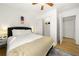 Bedroom featuring a plush bed, nightstand, and closet with doors, creating a cozy retreat at 2710 Hedgewood Nw Dr, Atlanta, GA 30311