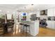 Modern kitchen with stainless steel appliances, island, and eat-in dining area at 2710 Hedgewood Nw Dr, Atlanta, GA 30311