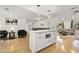 Modern kitchen island with stainless appliances overlooks an open-concept floorplan at 2710 Hedgewood Nw Dr, Atlanta, GA 30311