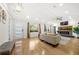 Bright living room features hardwood flooring, fireplace, and lots of natural light at 2710 Hedgewood Nw Dr, Atlanta, GA 30311
