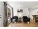 Cozy living room features lots of light with modern furnishings and hardwood floors at 2710 Hedgewood Nw Dr, Atlanta, GA 30311
