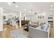 Open floor plan with kitchen, dining, and living room featuring hardwood flooring and natural light at 2710 Hedgewood Nw Dr, Atlanta, GA 30311