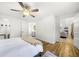 Bright main bedroom with hardwood floors, walk-in closet, ensuite bathroom, and natural light at 2710 Hedgewood Nw Dr, Atlanta, GA 30311