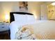 Close up of a bright main bedroom with a cozy bed, a nightstand, and recessed lighting at 2710 Hedgewood Nw Dr, Atlanta, GA 30311
